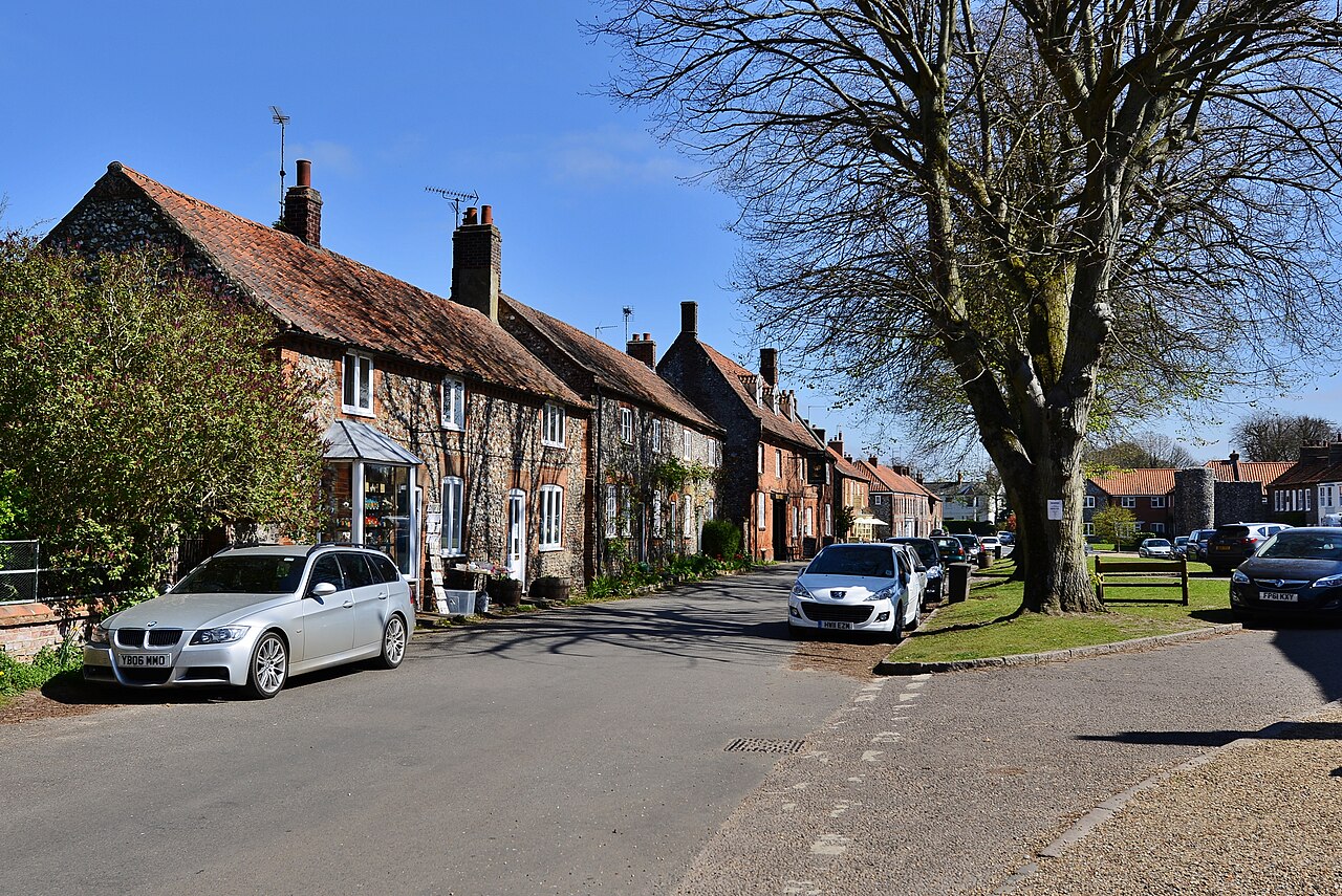 Castle Acre, The High Street from the churchyard entrance