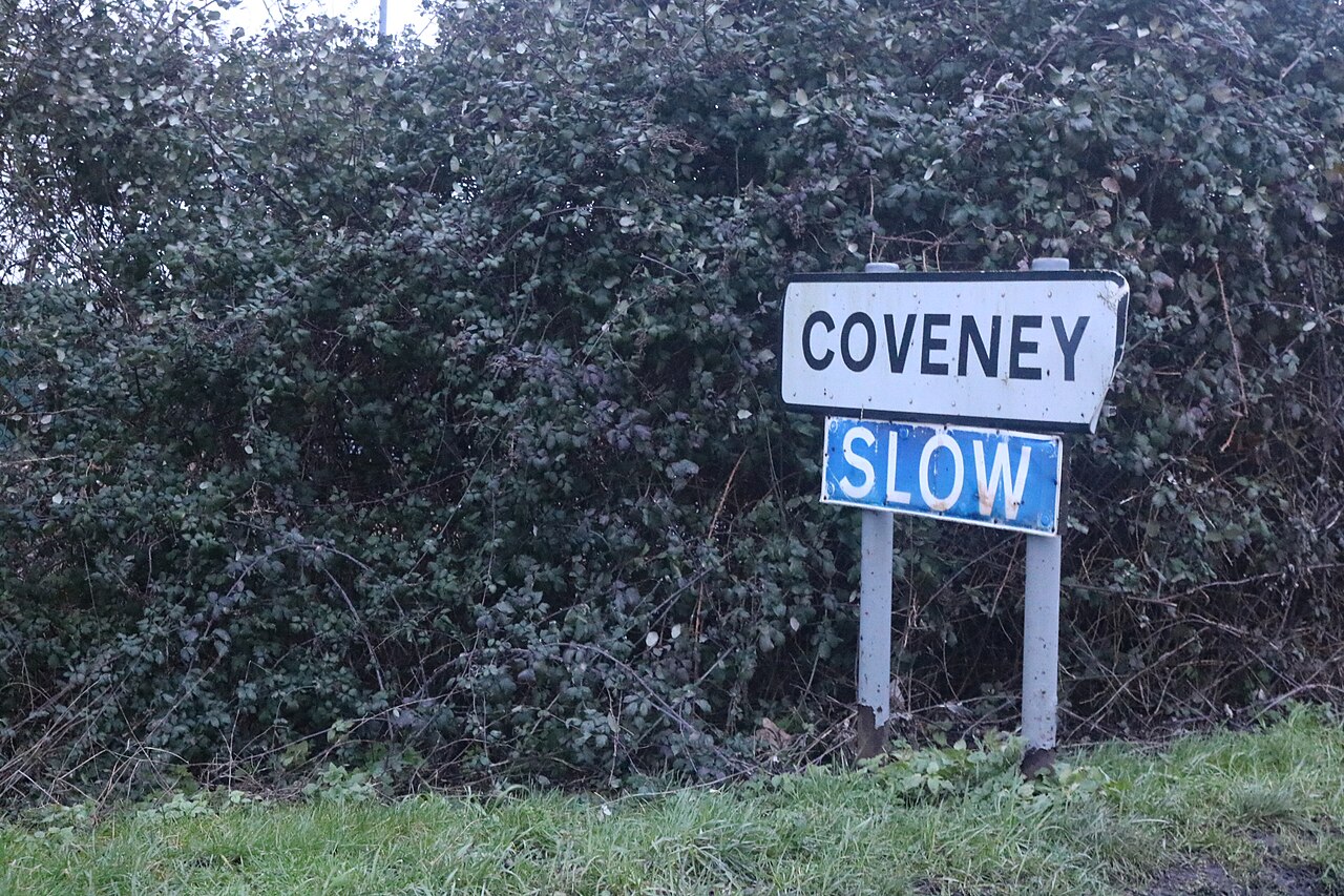 Village sign entering Coveney