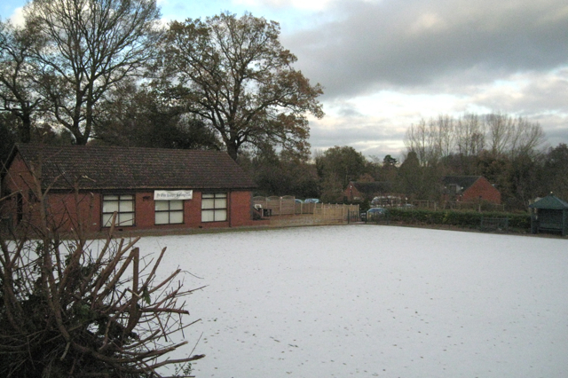 Bowling green under light snow
