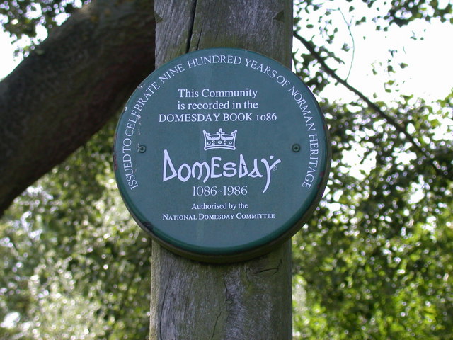Domesday plaque on Eversdens Village Sign