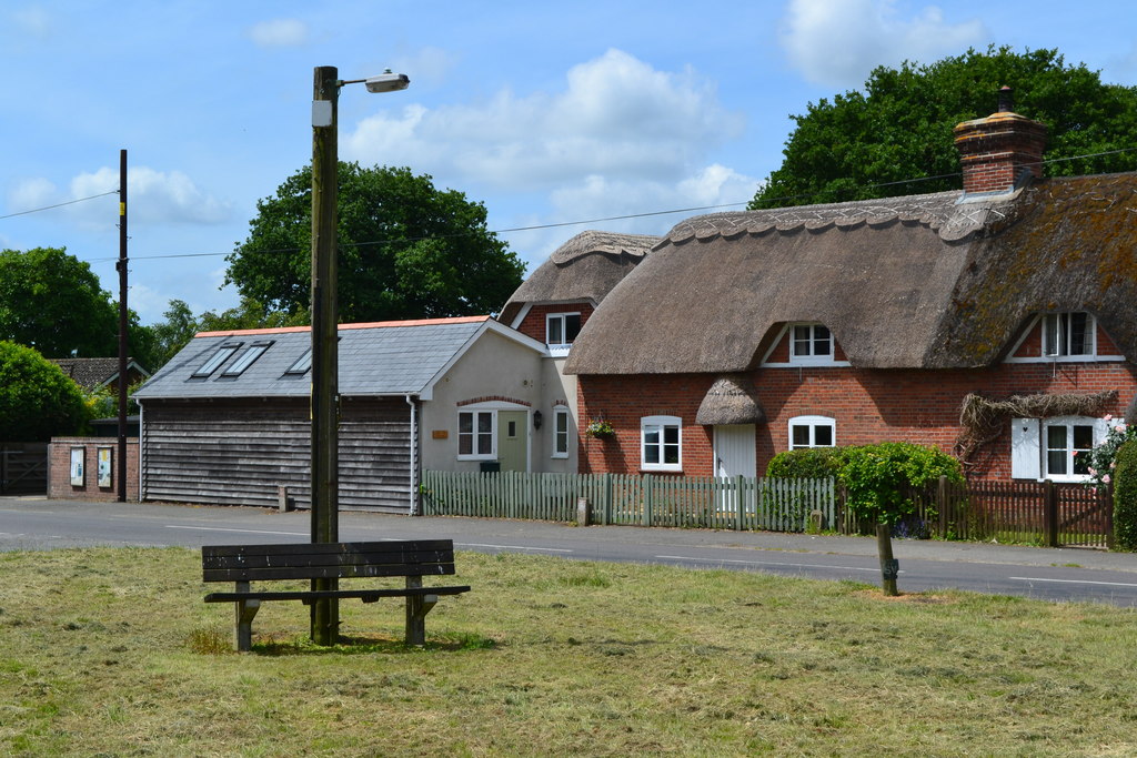 Thatched cottage beside triangular green