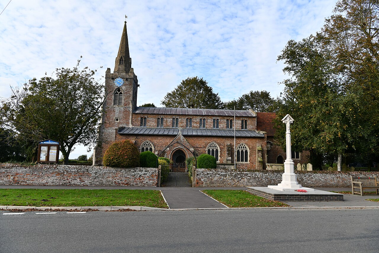 Lutton, St. Nicholas's Church, Southern aspect and the War Memorial