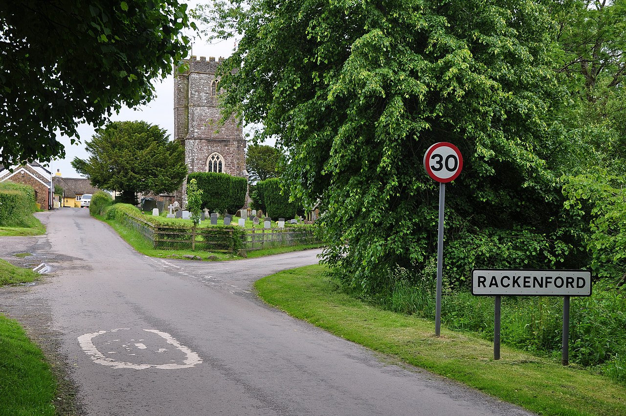 Rackenford , Village Sign ^ Road